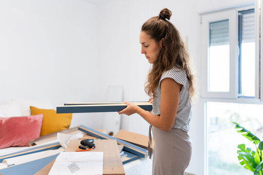 Young woman moving into a new house