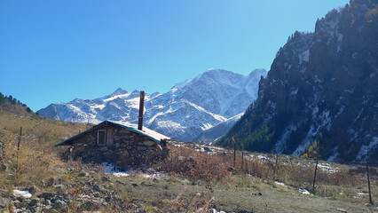 Hut in the mountains of the Elbrus region. Beautiful mountain landscape.
