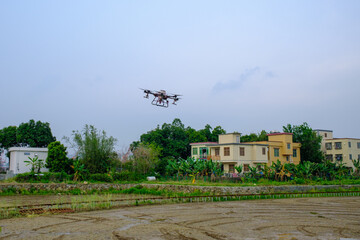 Agricultural drones work in the fields.