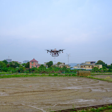 Agricultural drones work in the fields.
