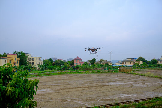 Agricultural drones work in the fields.