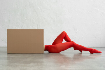 Performance of athletic woman in bright red tights with craft bo