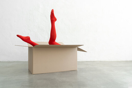 Performance of athletic woman in bright red tights with craft bo