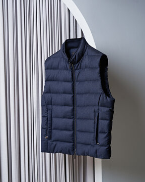 Stylish men's vest levitating on grey background