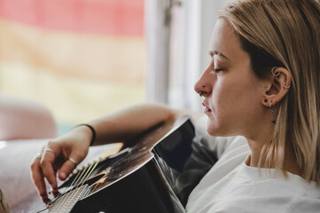 Modern girl playing guitar