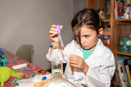 Kids playing with science toys at home