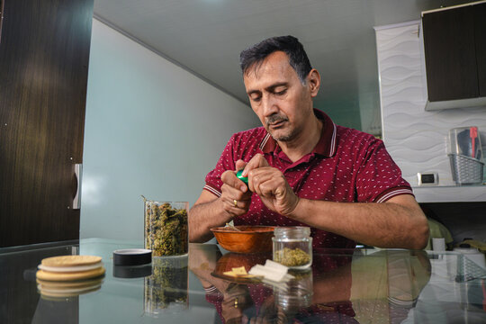 Man grinding weed