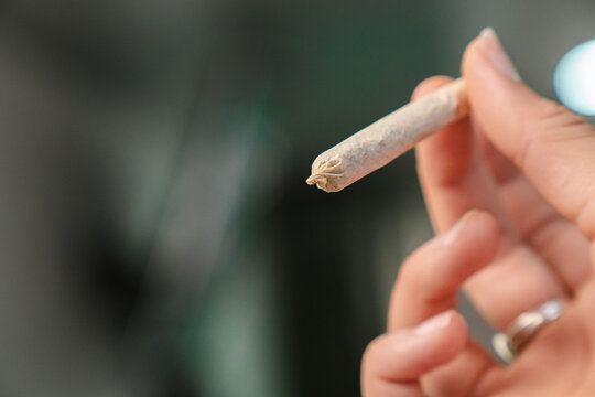 Woman holding a joint