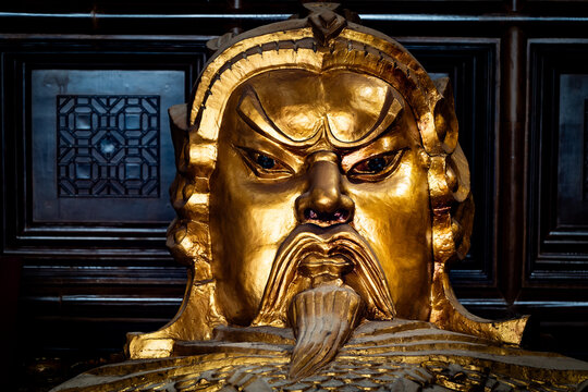 Golden Che Kung statue at a Buddhist temple in Hong Kong