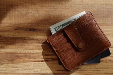 Wallet with dollars and bank cards