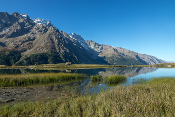 Fototapeta na wymiar Massif de la Meije au Lac du Pontet à Villar-d'Arène en été , Massif de l' Oisans , Hautes Alpes , France