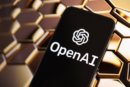 KYIV, UKRAINE - MARCH 17, 2024 OpenAI logo on iPhone display screen with background of artificial intelligence futuristic ai generated image close up