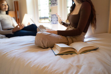 close up on student with book on a bed