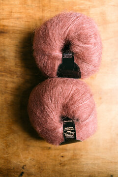 skeins pink and rusty yarn 
