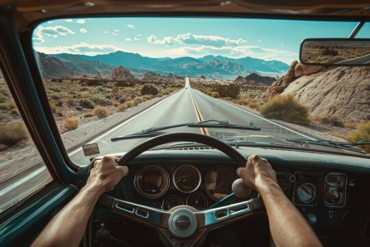 Fototapeta Driver's perspective from vintage car on open desert road, concept of adventure and road trip exploration
