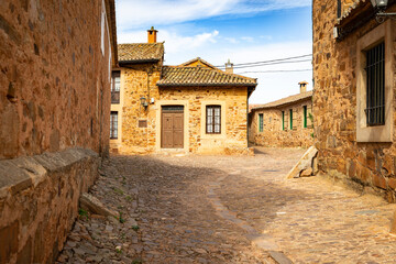 Fototapeta na wymiar street with traditional architecture in Castrillo de los Polvazares, municipality of Astorga, comarca of Maragateria, province of Leon, Castile and Leon, Spain
