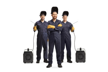 Full length portrait of a group of welders with welding machines