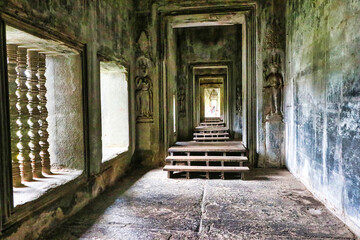 Scenes from Hindu and Buddhist mythologies depicted in Bas reliefs in the gallery of the Angkor Wat...