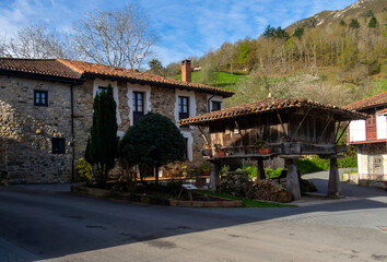 Fototapeta na wymiar Granary (horreo) in the mountain town of Espinaredo. In this village there are many examples of this particular traditional architecture. Piloña, Asturias, Spain.