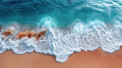 Foto op Aluminium An overhead view of the beach with gentle foam forming waves lapping the sandy shoreline © Eyd_Ennuard