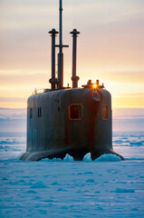 A Russia military modern black submarine on a combat mission in the under the ice of Antarctica on a day