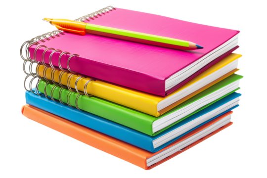 Colorful pens, pencils, and a notebook sprawl on a white desk ready for school or artistic endeavors