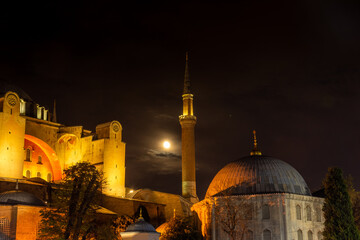 Full moon over Hagia Sophia minaret, Istanbul at night,  Turkey