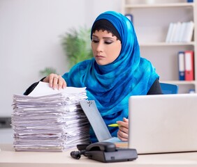 Female employee in hijab working in the office