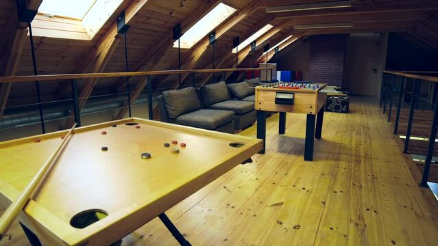 Games Room in Guest House or Hotel with Novuss Table and Table Football. Novuss, Koroona, or Korona is a Two or Four-player Game which is Closely Related to Carrom and Pocket Billiards.