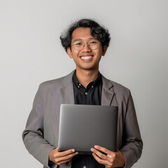 asian man holding laptop