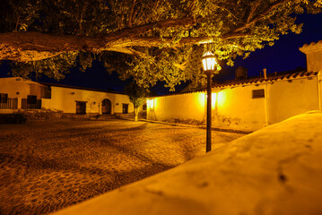 A nocturnal view of the cobblestoned, colonial center of Molinos village, Valles Calchaquíes,...