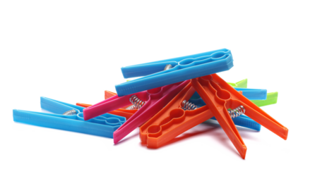 Colorful clothespins pile isolated on white