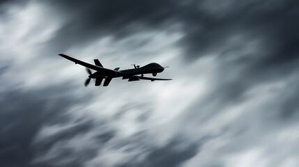 MQ-9 Reaper drone flying fast through the clouds, military technology concept