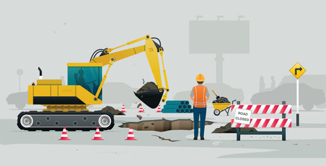 Engineer is operating a loader repairing a road in the city.