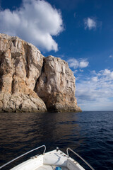 Punta Giglio promontory from the sea. Alghero, SS, Sardinia, Italy