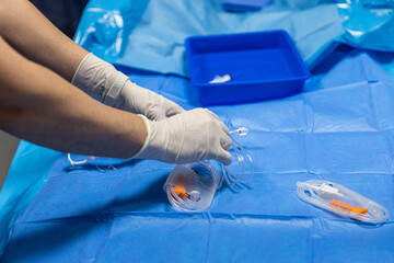 The procedure of inserting a double lumen catheter into a patient with cardiovascular occlusion in...