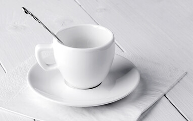 Empty coffee house cup with spoon and saucer