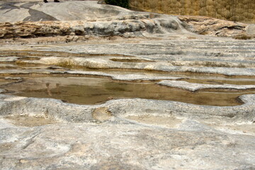 Shallow pools in the tavertine rock at Hierve el Agua in Oaxaca, Mexico - obrazy, fototapety, plakaty