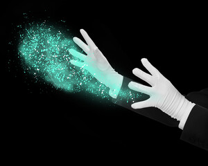 Magician performing magic trick on black background, closeup