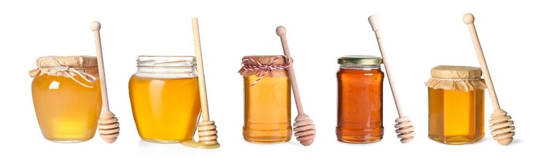 Natural honey in glass jars and dippers isolated on white, set
