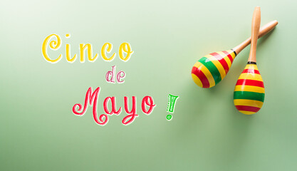 Cinco de Mayo holiday background made from maracas and the text on pastel background.