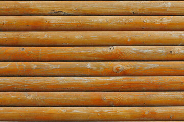 The image is of a wooden wall with many wooden planks