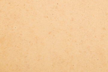 A tan background with few specks of dirt