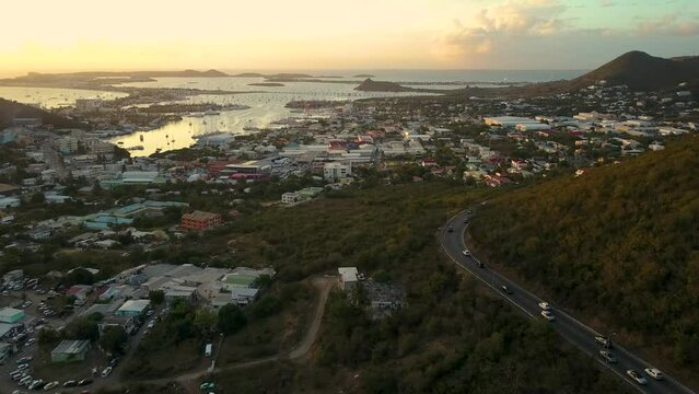 A.J.C. Brouwer Rd, Cole Bay, Sint Maarten. Aerial Pull back shot from Bell's Lookout Overlooking Simpson Bay at Sunset
