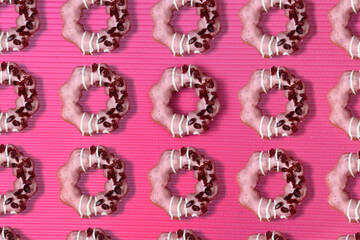 Pattern of doughnut in pink and graphic style background