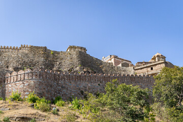 Fototapeta na wymiar ancient fort wall ruins with bright blue sky at morning