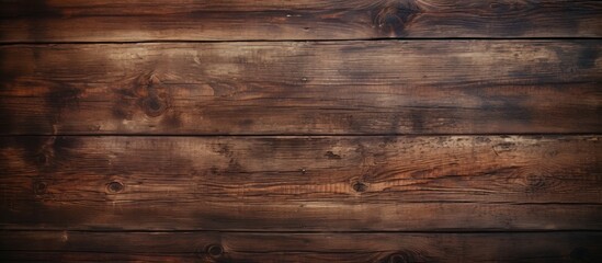 Obraz premium A closeup of a rectangular brown hardwood table with wood stain and a beautiful pattern, set against a blurred background