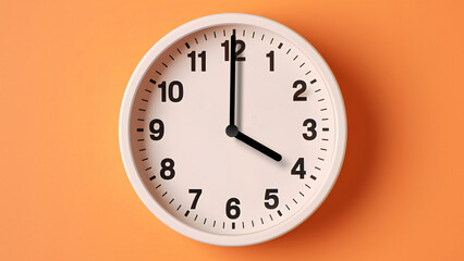 Analog wall clock spinning animation through the hours, time passing, time lapse, orange background