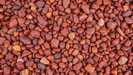 Fototapeta premium Small grey river pebbles top view