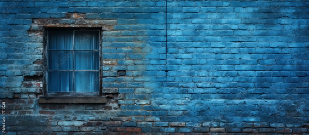 Poster the electric blue brickwork facade of the building features a rectangular window and door, creating 
